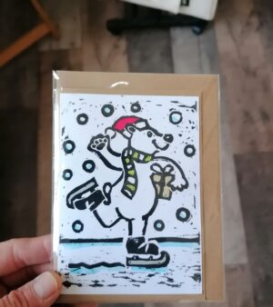 A6 Lino Print Xmas Card - Ice Skating Polar Bear (On Brown Kraft Paper)